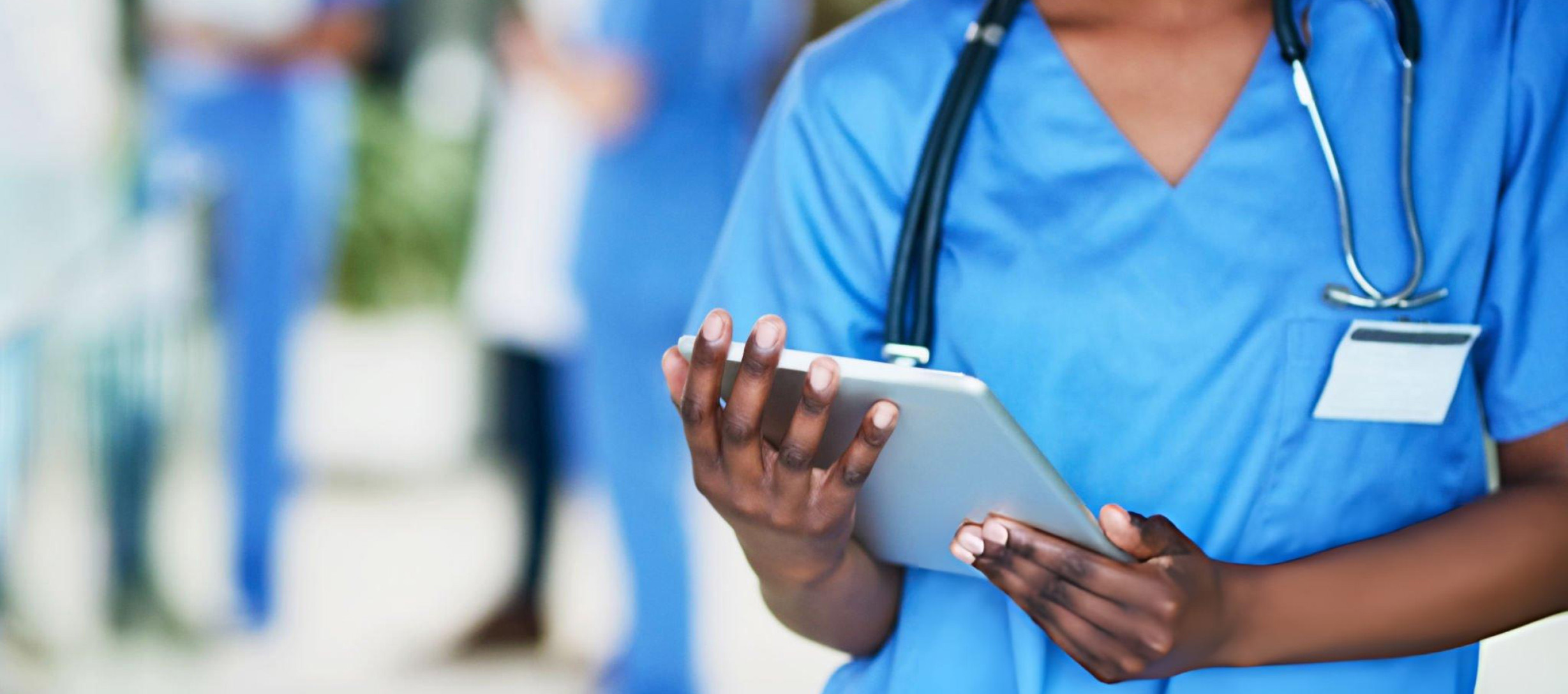 African healthcare professional using a digital tablet